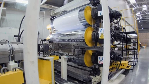 Motion to machine tool with rollers stretching plastic sheet Stock-Footage 107358751