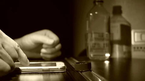 Motion of man browsing screen on smart phone and drinking water Video stock 84835984