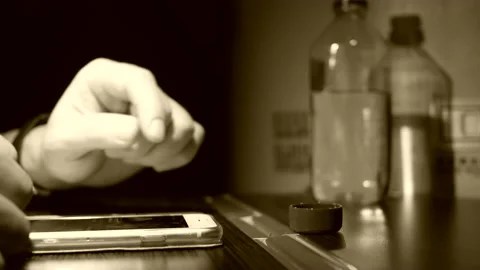 The motion of man browsing screen on smartphone and drinking water Video stock 170762090