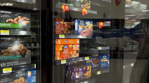 The motion of man buying appetizer assortment inside Walmart store Stock Footage 165870338