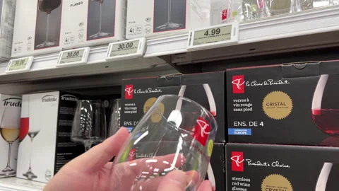 Motion of man buying a wine clear glass inside Superstore with 4k resolution Stock Footage 280293211