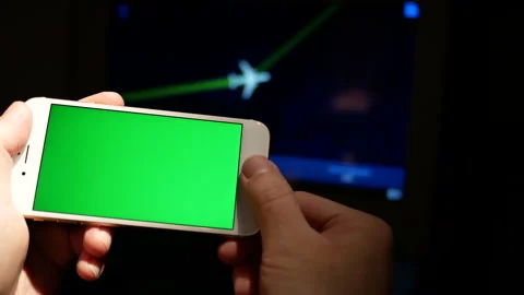 The motion of a man holding a green screen smartphone Stock Footage 242407537