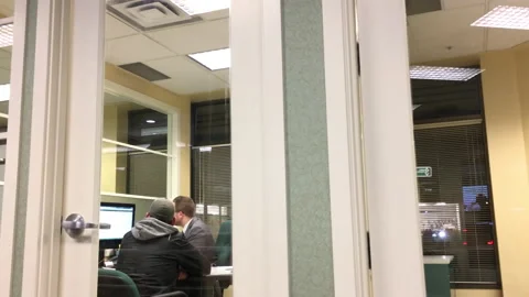 Motion of man opening mutual fund account with financial manager inside TD Bank Stock Footage 86334189