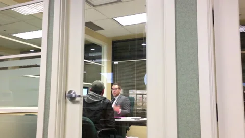 Motion of man opening mutual fund account with financial manager inside TD Bank Stockbeeldmateriaal 86341460