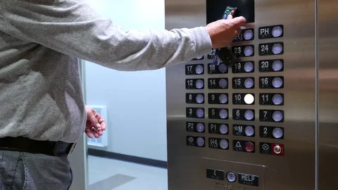 Motion of man presses a button the twenty seven floor in an elevator Video stock 79914979