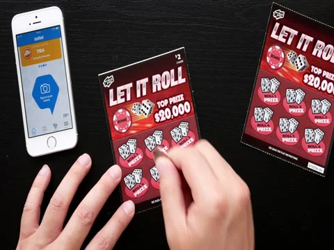 Motion of man scratching lottery ticket and checking lottery ticket by app. 스톡 동영상 76629833