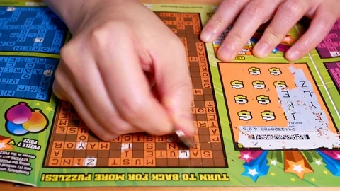 Motion of man scratching lottery ticket with 4k resolution. 스톡 동영상 78115937