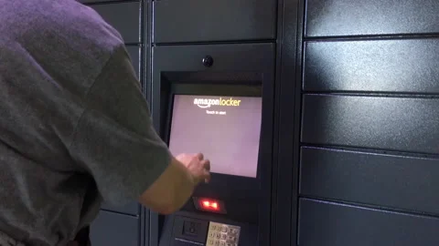 Motion of man taking his parcel and typing access code on screen Stock Footage 104170784