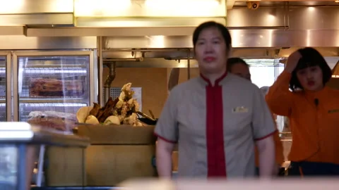 Motion of manager checking the light on roof near kitchen inside restaurant Stock Footage 97049230