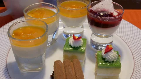 Motion of mango mousse and mini cake on table inside restaurant 스톡 동영상 96579464