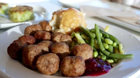Motion of meal on table with sun ray reflection on plate inside Ikea store Stock Footage 76211409