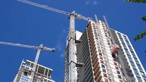 Motion of modern high rise building with construction crane Stock Footage 78992678