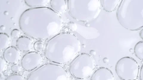 Motion of molecule bubbles in a cosmetic serum, macro. Transparent cosmetic.. Stock Footage 274547825
