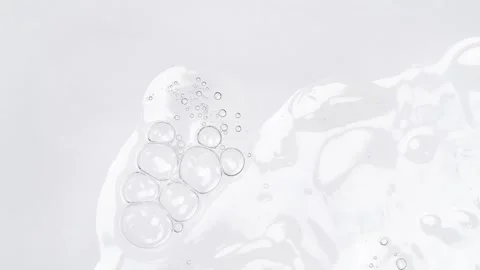 Motion of molecule bubbles in a cosmetic serum, macro. Transparent cosmetic.. Stock Footage 274557531