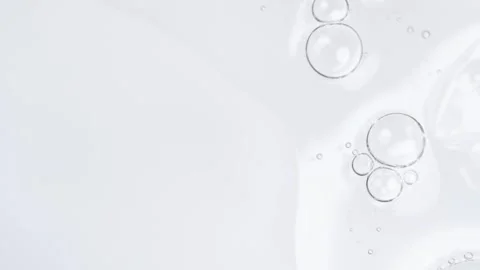 Motion of molecule bubbles in a cosmetic serum, macro. Transparent cosmetic.. Stock Footage 275069297