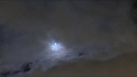 Motion of the moon among the clouds timelapse 스톡 동영상 77284299