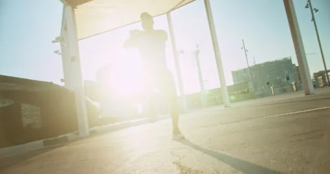 Motion movement of active energetic guy doing exercises squats morning leisure Stock Footage 140740347