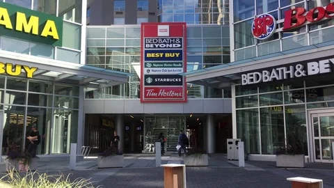 Motion of multiple store front with people and car passing by store 스톡 동영상 78995608