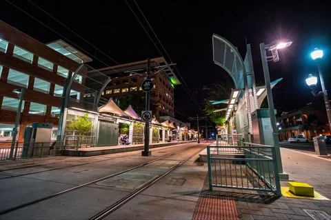 Motion Night Time Lapse of a Rail Metro Station from Ground Level Stock Footage 79631427