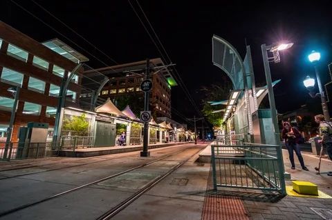 Motion Night Time Lapse of a Rail Metro Station from Ground Level 6K Stock Footage 79631531