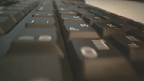 Motion over computer keyboard while woma... | Stock Video | Pond5