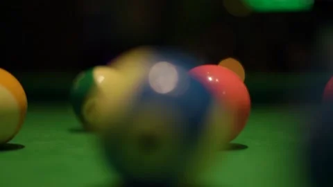 Motion past balls on pool table covered with green fabric Stock Footage 152076995