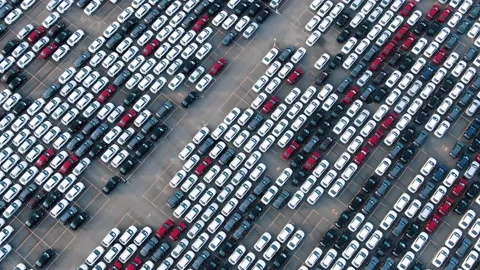 Motion past long rows of finished cars in factory warehouse Stock Footage 165077460
