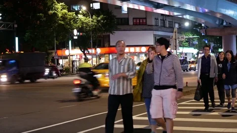 Motion of pedestrian crossing road at night in Taipei Taiwan with 4k resolution. Stock Footage 81644575