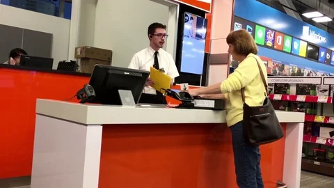 Motion of people buying acer computer at Geek squad section 스톡 동영상 70152616