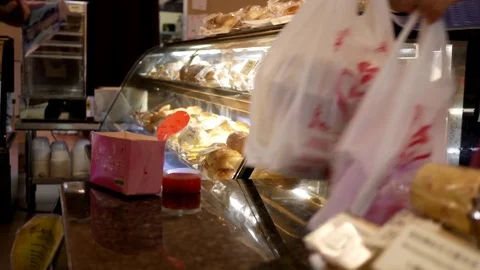 Motion of people buying bread and paying cash Stock Footage 77589317