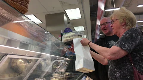 Motion of people buying cake inside price smart foods store Stock Footage 108013299