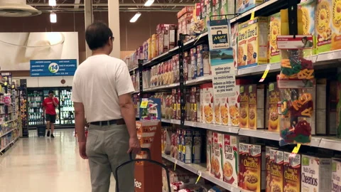 Motion of people buying cereal inside Save on Foods store with 4k resolution Stock Footage 92199271