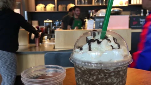 Motion of people buying coffee inside Starbucks store Video stock 94131908