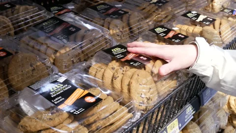 Motion of people buying cookie inside Walmart store with 4k resolution Stock Footage 102283609