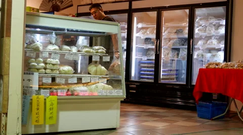 Motion of people buying dumpling and bread inside dim sum world store Stock Footage 65798692