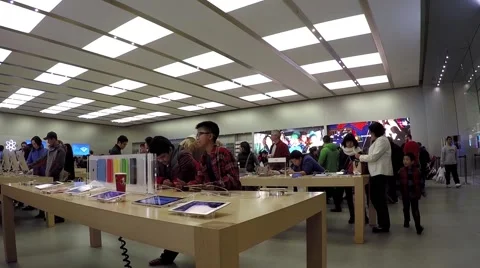 Motion of people buying new iphone inside apple store Stock Footage 45546212