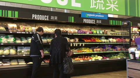 Motion of people buying vegetable inside price smart foods store Stock Footage 108012973