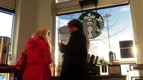 Motion of people chatting and putting cream for their coffee Video stock 74775475