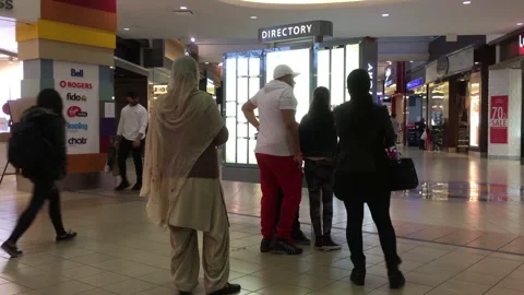 Motion of people checking store position in front of directory sign Video stock 108282952