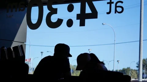 Motion of people drinking coffee inside Starbucks store with back light shot Video stock 79843909