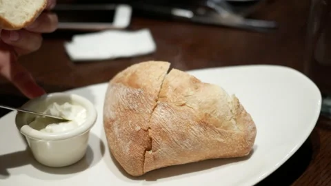 The motion of people eating bread inside The keg steakhouse and bar Stock Footage 235454289
