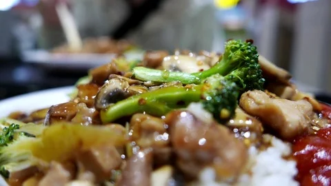 Motion of people eating fried chicken and rice at food court area Stock Footage 76486833