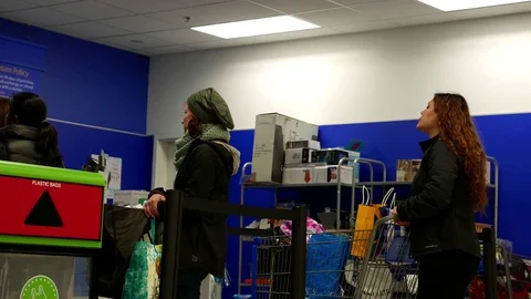 Motion of people line up for returing items at customer service counter Stock Footage 70884952