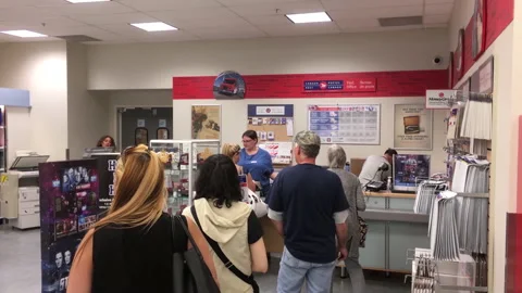 The motion of people lining up for taking their parcel at the post office Stock Footage 237933804