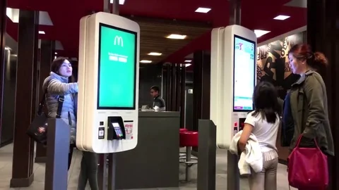 Motion of people ordering food at self check out machine at Mcdonalds Stock Footage 69079135
