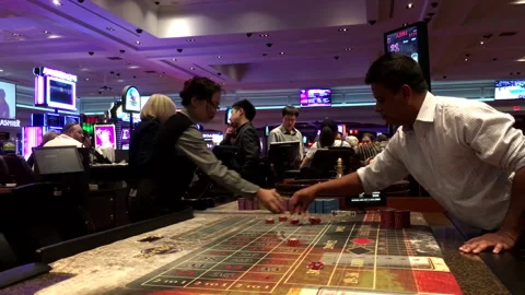 Motion of people playing roulette inside  Casino with 4k resolution Stock Footage 104638128