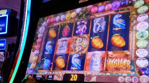Motion of people playing slot machine and winning big prize inside Casino Stock Footage 93880987
