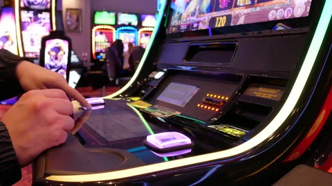 Motion of people playing slot machine inside Casino with 4k resolution Stock Footage 100701026