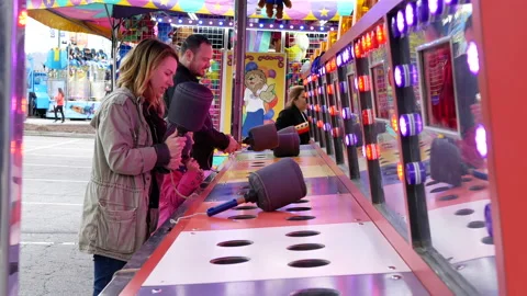 Motion of people playing whack game at Amusements Carnival Stock Footage 89457799