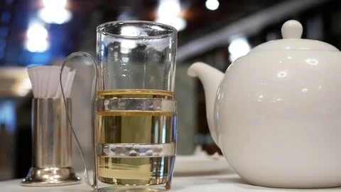Motion of people pouring hot tea inside Grand Hyatt Taipei restaurant Stock Footage 81314722
